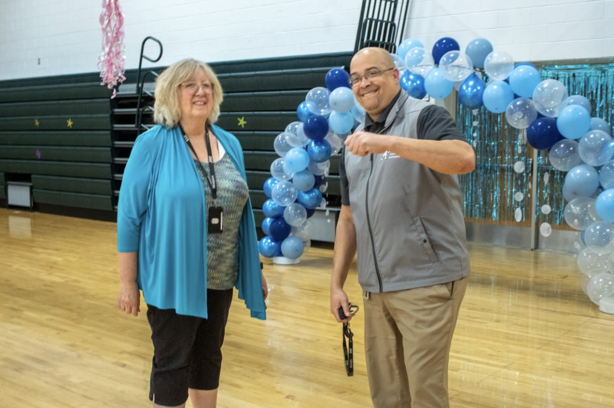 Ms. Linda Seidel and Mr. Rodney Redd celebrate the adapted prom's success.